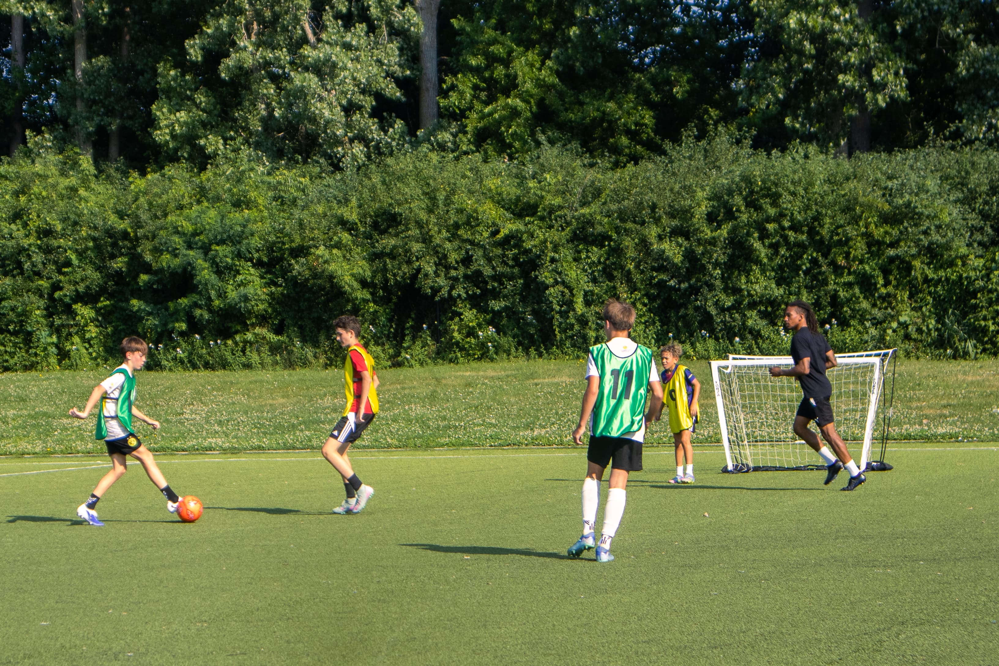 Players competing in small-sided outdoor soccer